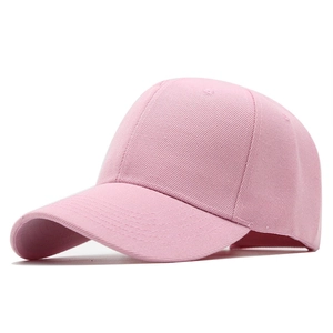 Close-up of pink cotton twill baseball cap showing six-panel structure and curved brim