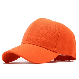 Side view of orange cotton baseball cap with adjustable strap and breathable holes