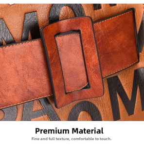 Macro shot of retro tan leather texture with black letter print and vintage square buckle