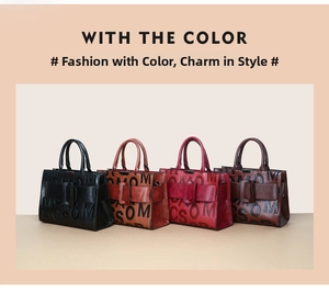 Detail view of large tote bags in four colors with embossed letters and stylish straps