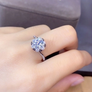 Elegant halo diamond ring with round brilliant cut center stone and pavé set band