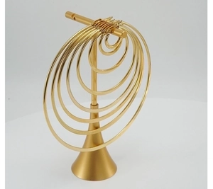 Polished gold stainless steel hoop earrings in various sizes on a display stand
