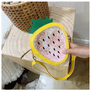 Detail of strawberry shape crossbody bag with pink star sequins and yellow PU leather