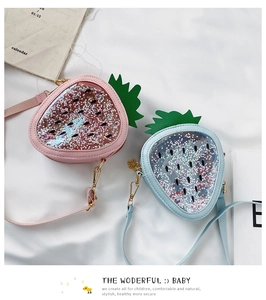 Detail of strawberry crossbody bags with sparkling star sequins and clear PVC windows