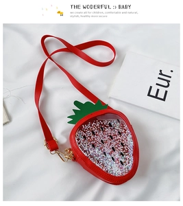 Detail of red strawberry sequin bag showing sparkling glitter stars and PVC panel
