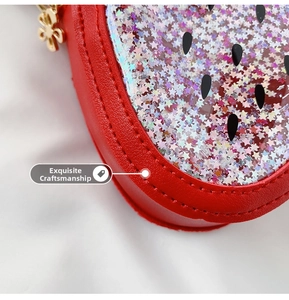 Macro shot of precise stitching and glitter star sequins on the red strawberry bag