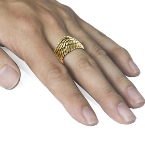 Golden angel wing open ring with vintage feather texture on model index finger