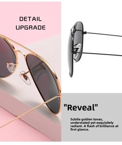 Detail view of aviator sunglasses showing metal frame quality and soft silicone nose pads