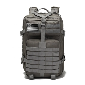 Close-up of durable nylon tactical backpack with Molle system and grey fabric texture