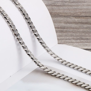 Polished silver Cuban link body chain made of titanium steel for a minimalist fashion look