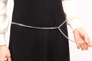 Detailed view of silver stainless steel NK chain body jewelry with circular link clasp