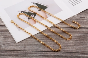 Detailed macro view of the golden role chain with its secure lobster clasp closure