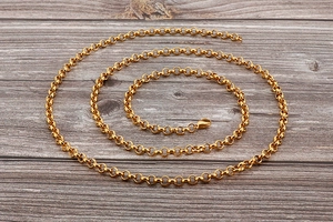Macro shot of gold polished metal rings chain for jewelry body accessories