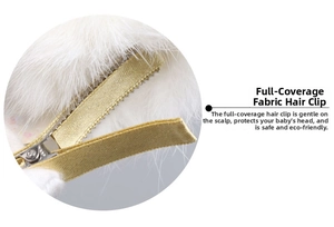 Detail of fully fabric-wrapped metal hair clip with soft white feather for girls