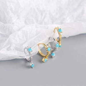 Detail of S925 sterling silver hoop earrings with blue turquoise and white zircons