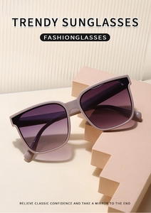 Detail view of stylish square nude frame sunglasses with purple gradient lenses on display