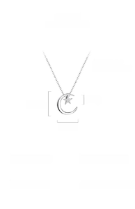 Macro detail of S925 sterling silver moon and star pendant with sparkling zircon inlay