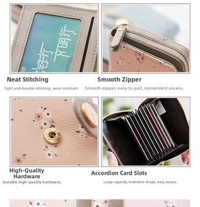 Details of pink floral wallet featuring metal zipper, snap button, and multi-card slots