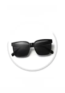 Detail view of black square oversized sunglasses showing model number on inner temple