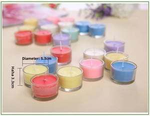 Detail view of colorful scented candles in clear glass cups measuring 5.3x3.3 cm each