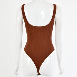 Macro view of brown ribbed knit backless bodysuit on mannequin with thong cut detail