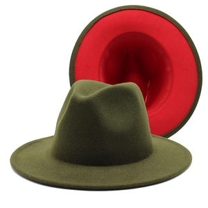 Detail of wool fedora hat showing olive green exterior and contrasting red inner brim