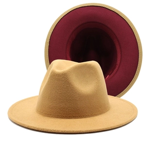 Detail of wool fedora showing khaki exterior and contrasting burgundy interior lining