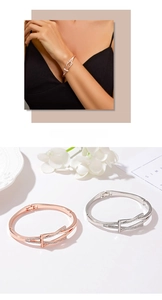 Detail of geometric crisscross bracelets in rose gold and silver with zircon inlays