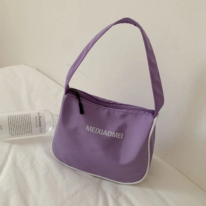 Detail of light purple nylon baguette bag with white trim and MEIXIAOMEI text