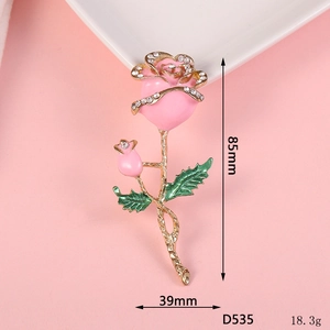 Detailed view of rose flower charm with pink enamel petals and sparkling rhinestones