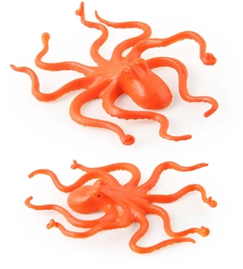 Macro detail of two orange octopus toys showing realistic skin texture and flexible tentacles