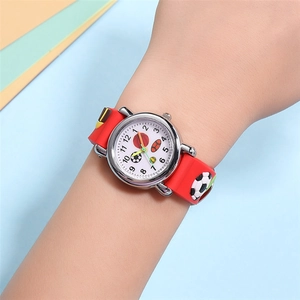 Close-up of kids red soccer watch with 3D embossed football strap and white dial