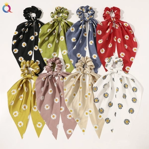 Eight pack of colorful satin hair scrunchies with long ribbons and daisy floral prints
