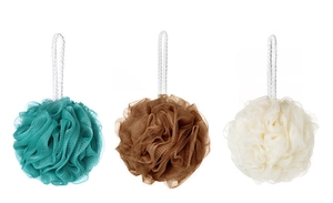 Detailed view of three soft mesh loofahs in teal, brown, and beige with white hanging ropes