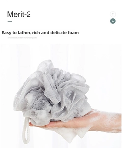 Close-up of soft grey bath sponge mesh producing rich white lather foam for body care