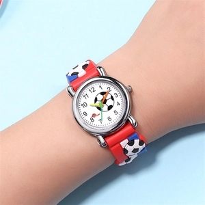 Close-up of a 3D soccer relief strap and colorful dial on a red children's sports watch