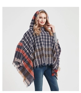 Detail of hooded plaid poncho with fringe tassels in navy blue and red checkered pattern