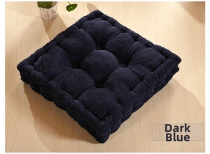 Macro detail of dark blue thickened corduroy cushion texture with nine-hole quilting finish
