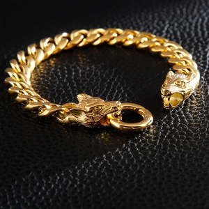 Golden titanium steel double wolf head bracelet with heavy Cuban chain on leather