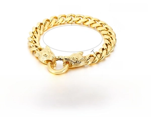 Detail view of gold stainless steel cuban chain bracelet featuring dual wolf heads motif