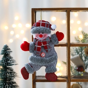 Charming red and grey plaid snowman Christmas ornament hanging on a wooden frame