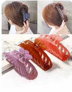 Detail of matte purple, brown, and coral hair claws with strong metal springs