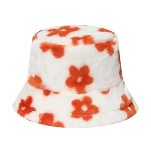 Plush bucket hat with orange floral patterns on a white background for autumn winter