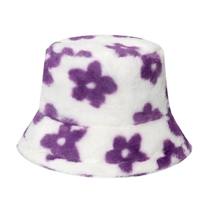 Winter plush bucket hat featuring purple floral patterns on a white fluffy surface