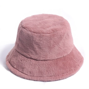 Close-up of pink faux fur bucket hat showing plush texture and warm winter material