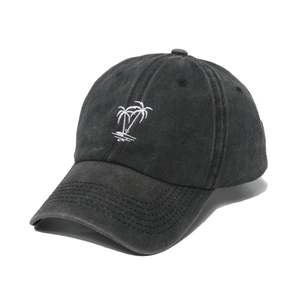 Washed black baseball cap with white coconut tree embroidery shown from a 45-degree angle