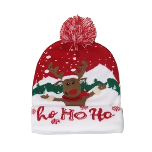 Detailed close-up of Christmas knit hat featuring reindeer pattern and LED lights