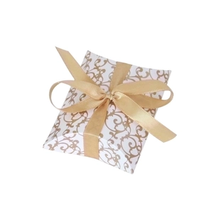 Elegant white pillow gift box with golden vine patterns and a decorative silk bow