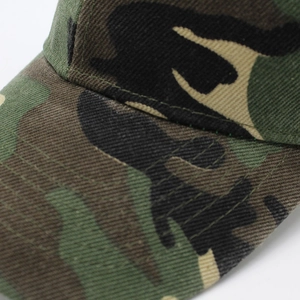 Detail of reinforced stitching and camouflage fabric pattern on a baseball cap