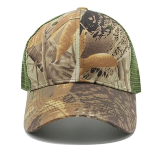 Detail of leaf camouflage trucker hat featuring breathable green mesh and curved brim
